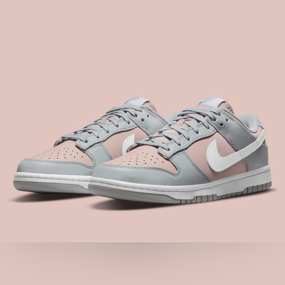 Gray and light pink Nike dunk lows